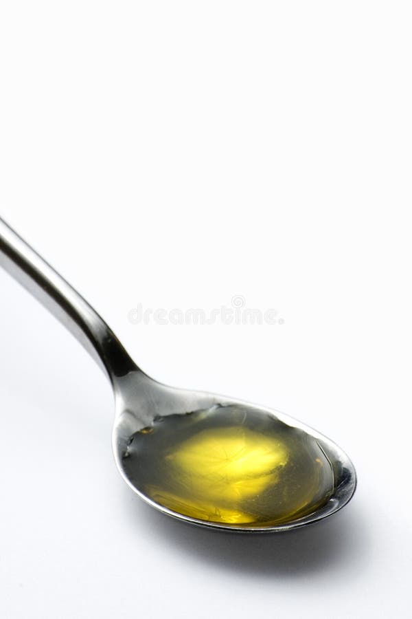Teaspoon of olive oil stock image. Image of device, instrument 6392163