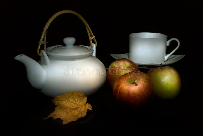 Caravaggio-esque still life with teapot, cup, fruit and leaf. Caravaggio-esque still life with teapot, cup, fruit and leaf
