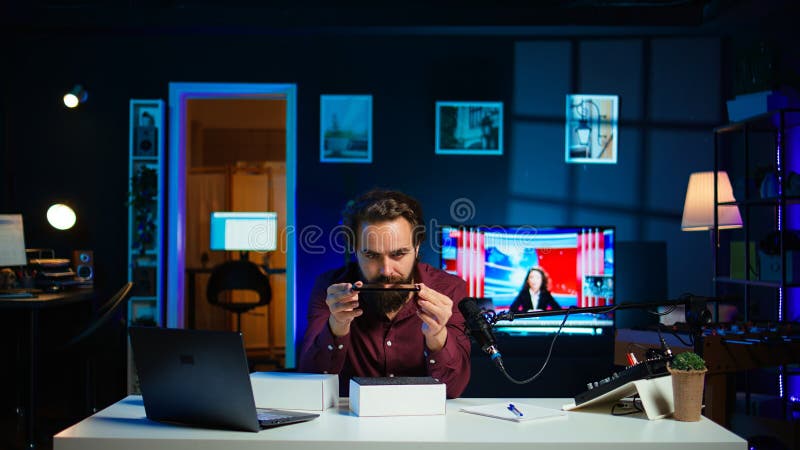 Vlogger presenting best smartphones on the market stock images