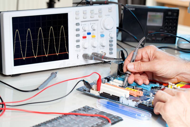 Tech tests electronic equipment