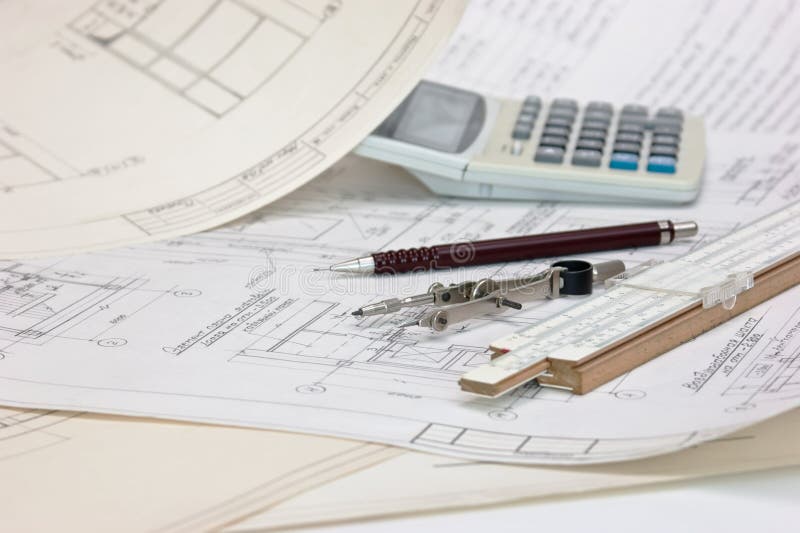 Technical drawings and slide rule stock photo Technical drawings and slide rule stock photo