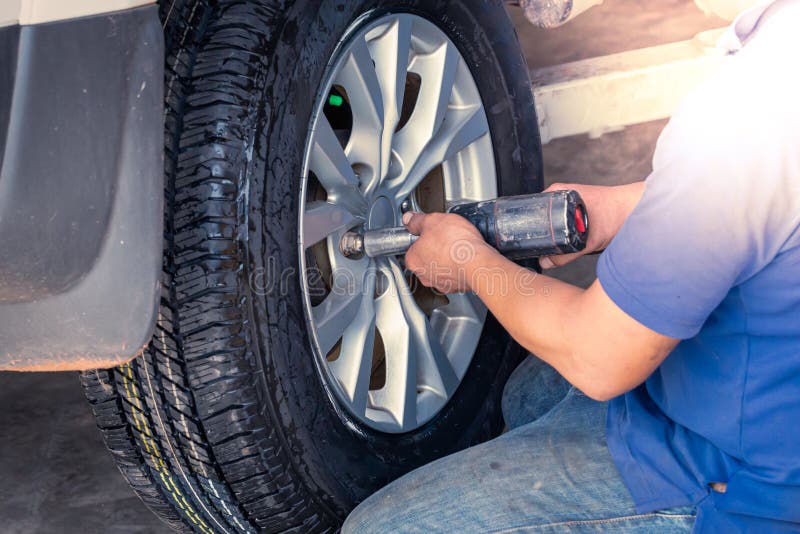 Technician is Changing the Tire Wheels Stock Photo Image of vehicle