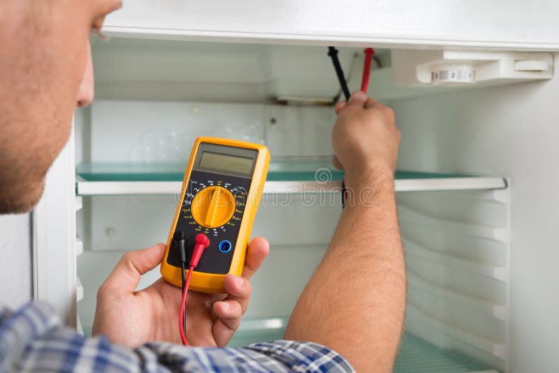 Technician Checking Fridge with Multimeter Stock Photo Image of