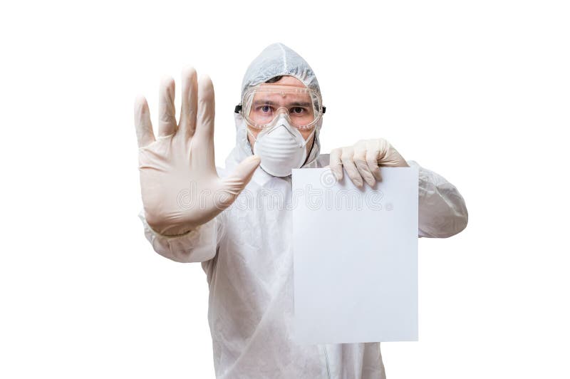 Technician in coveralls is holds blank paper for custom text. royalty free stock image