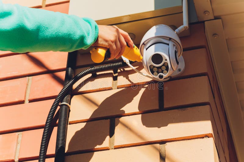 Technician Female Setup Cctv Camera on Wall. Stock Image Image of