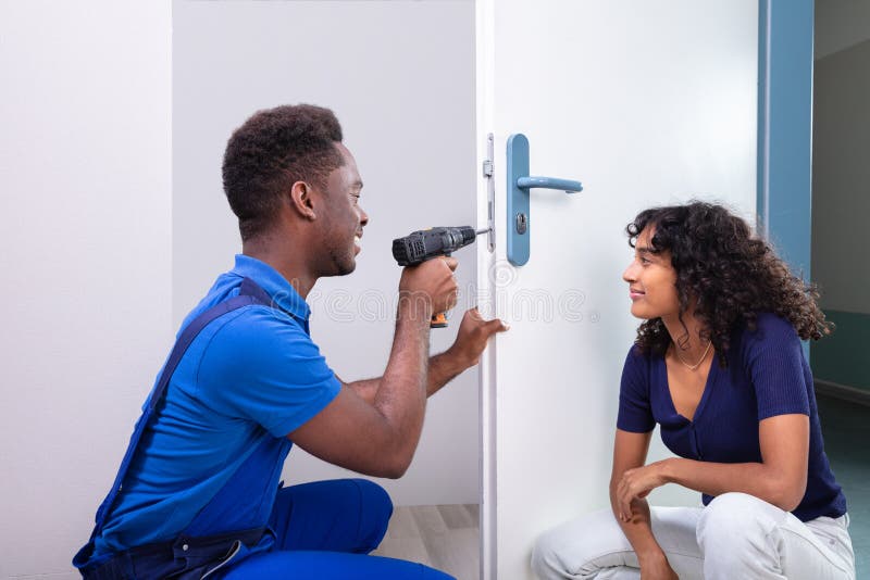 Technician Fixing The Door Lock