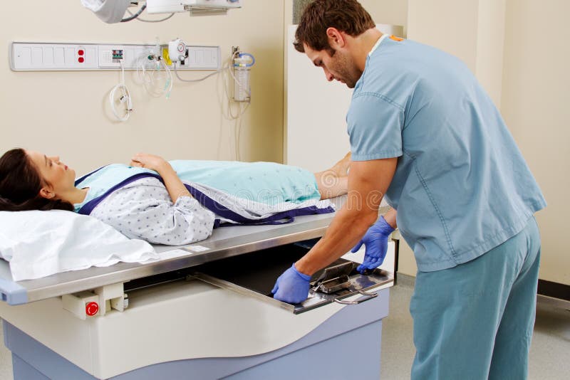 Technician Inserting Plate for Xray Stock Photo Image of radiologist