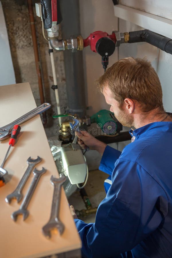 Technician Instaling Heating System Stock Photo Image of pipe, repair