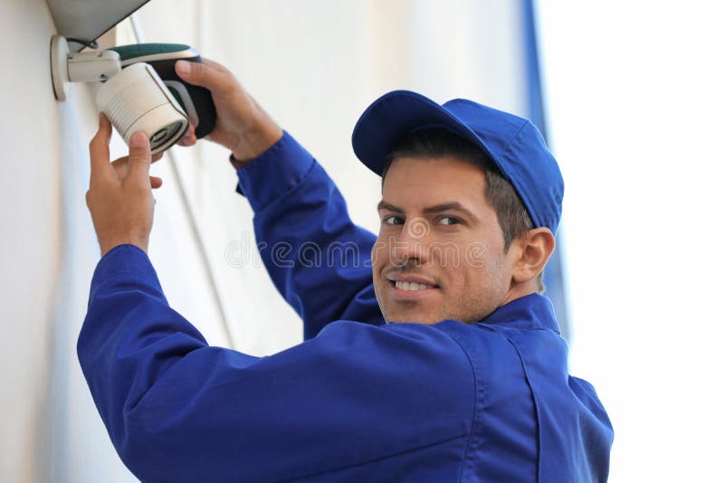 Technician Installing CCTV Camera on Wall Outdoors Stock Photo Image