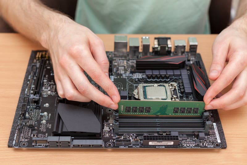 Technician Installing random access memory into PC. royalty free stock photos