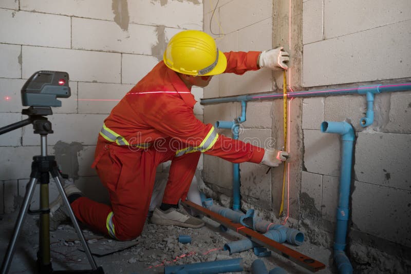 Technician with Laser measurement level during work