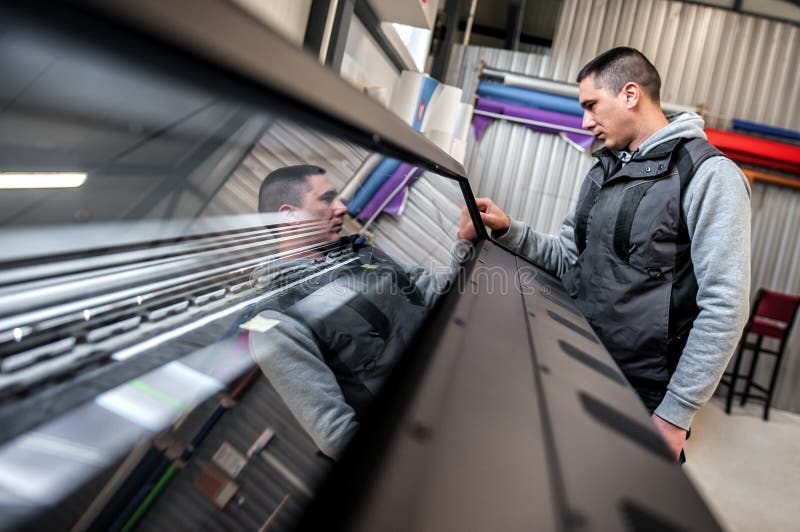 Technician operator checking status on touchscreen front display monitor station royalty free stock images