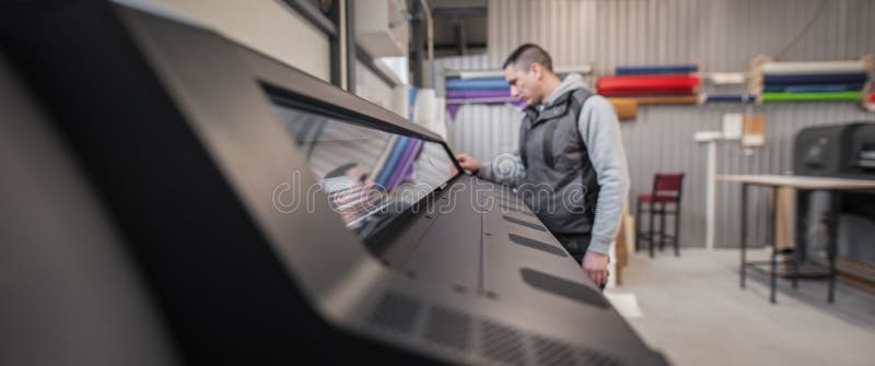 Technician operator checking status on touchscreen front display monitor station stock photo