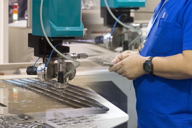 The technician operator for control water jet machine stock images