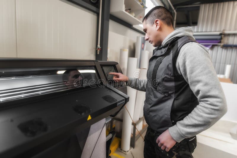 Technician operator checking status on touchscreen front display monitor station royalty free stock image