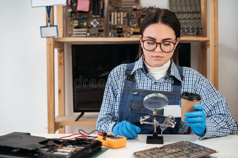 Technician repairing computer hardware. Small business owner of a computer repair store. Computer repair stock images
