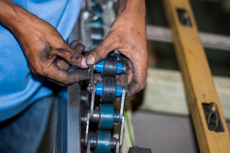 The Technician Repairing Conveyor Belt in Factory. Stock Photo Image