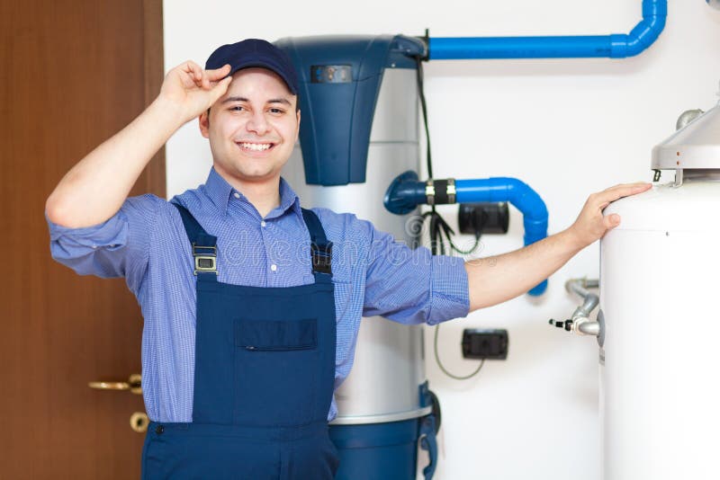 Technician Repairing an Hotwater Heater Stock Photo Image of room