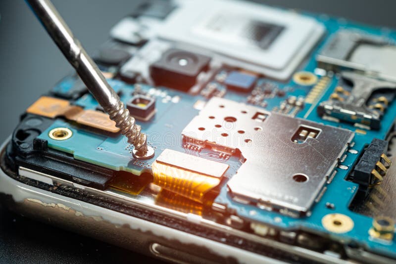 Technician Repairing Inside of Mobile Phone by Soldering Iron