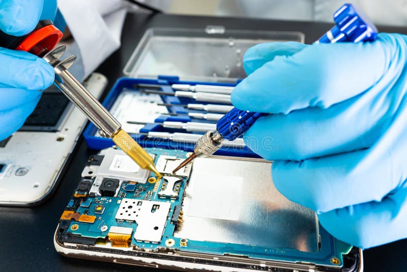 Technician Repairing Inside of Mobile Phone by Soldering Iron
