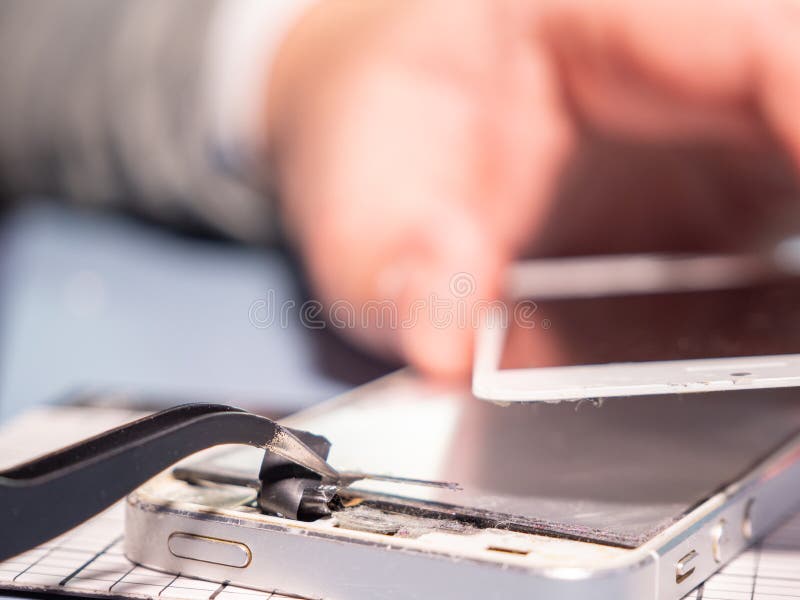 A Technician Repairs a Smartphone in a Laboratory with Copy Space