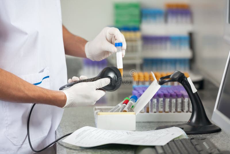 Technician Scanning Samples With Barcode Reader stock photography