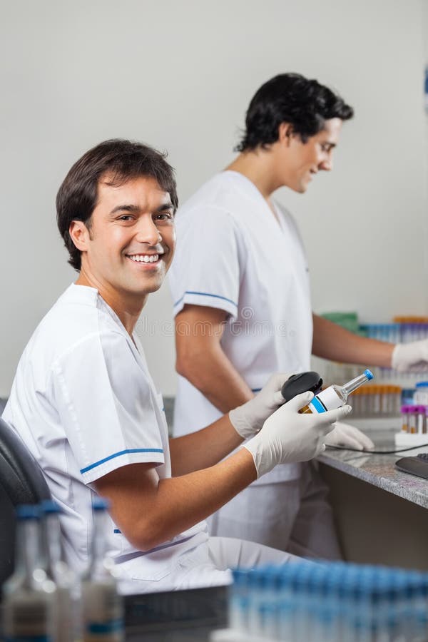 Man Scanning Barcode on Specimen Stock Image - Image of laboratory