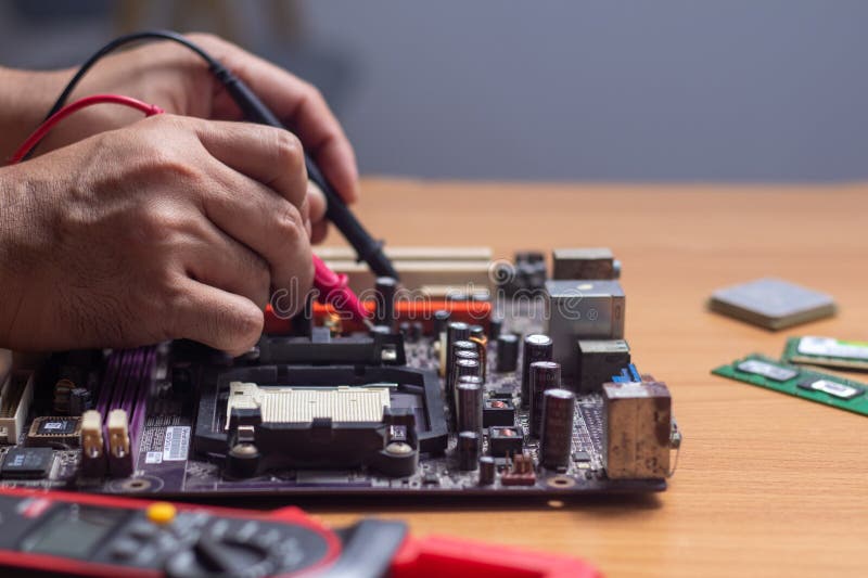 Technician Using Tool To Measure Circuit Board, Check and Repair Stock ... Circuit Diagram