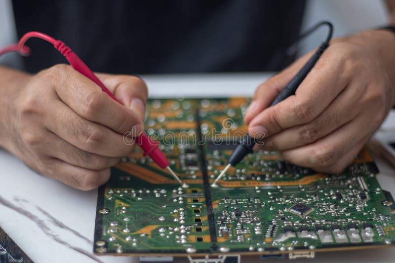 Technician Using Tool To Measure Circuit Board, Check and Repair Stock ... Circuit Diagram
