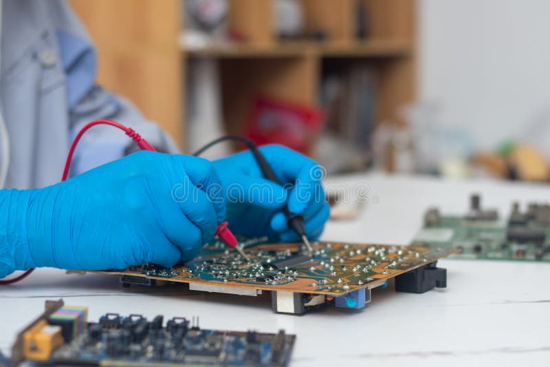 Technician Using Tool To Measure Circuit Board, Check and Repair Stock ... Circuit Diagram