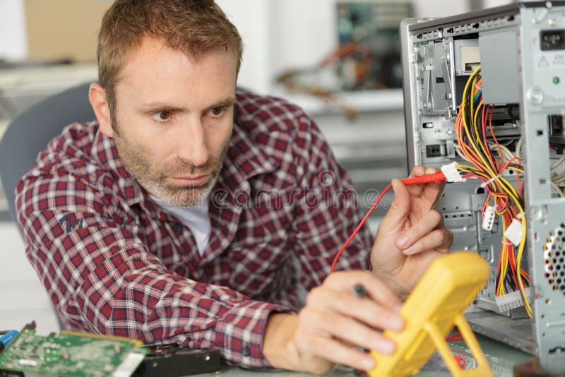 Technician Using Voltage Meter for Computer Stock Image Image of