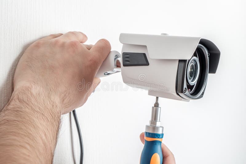 Technician Worker Installing Video Surveillance Camera Stock Photo