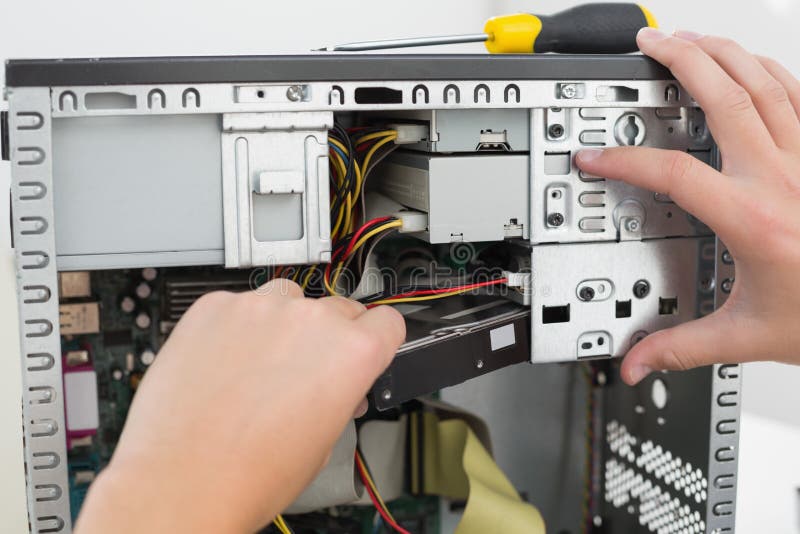 Technician working on broken computer royalty free stock image