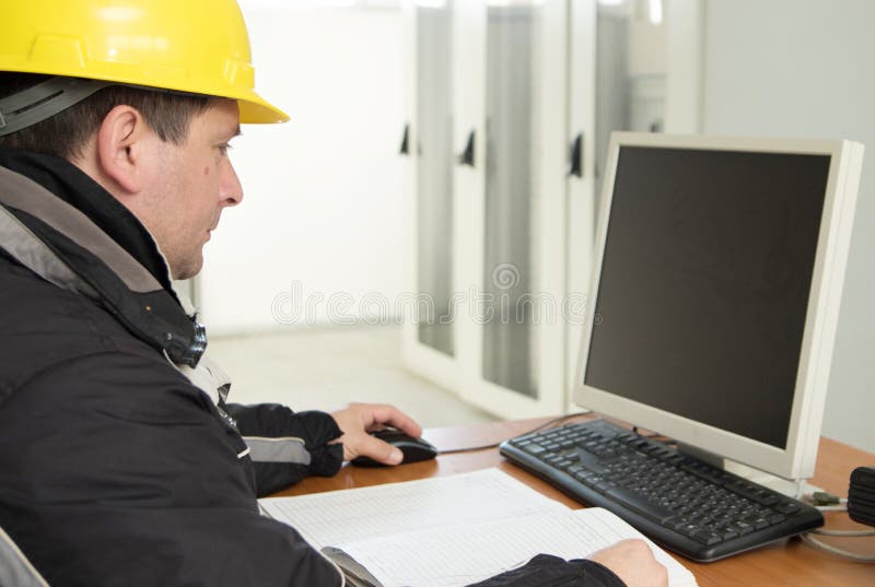 Technician Working on the Computer in the Power Plant Control C Stock