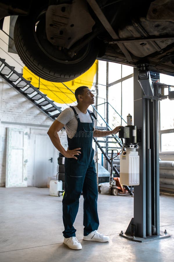 Technicians at Car Service Doing Car Lift for Car Inspection Stock Photo Image of worker