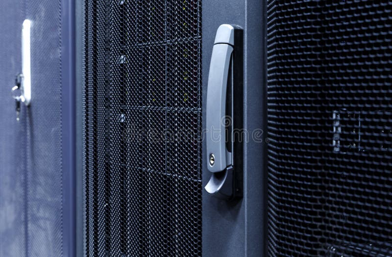 Technological background with close up grid closed doors in data center royalty free stock photography