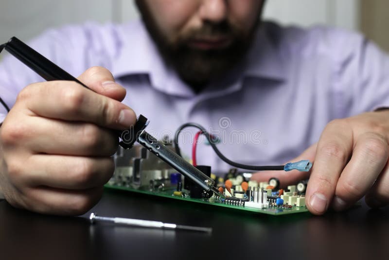 Chip soldering man hands stock image. Image of person 103211225