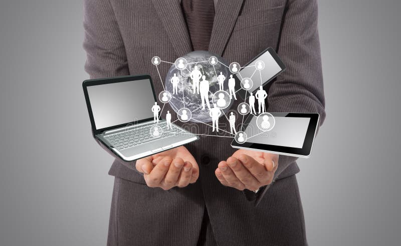 Business man with technology concept in his hand, grey background. Male hand holding businessman stock images, royalty-free photos and pictures