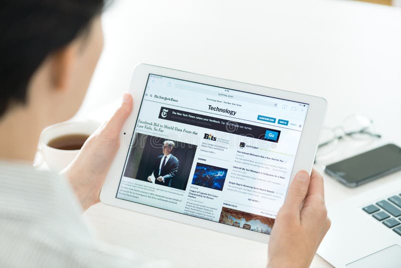 Technology news on Apple iPad Air stock photos