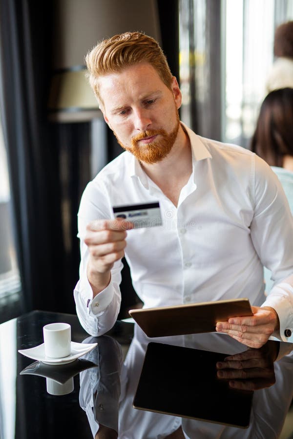Technology people and online shopping concept. Happy man with tablet pc computer and credit card royalty free stock image