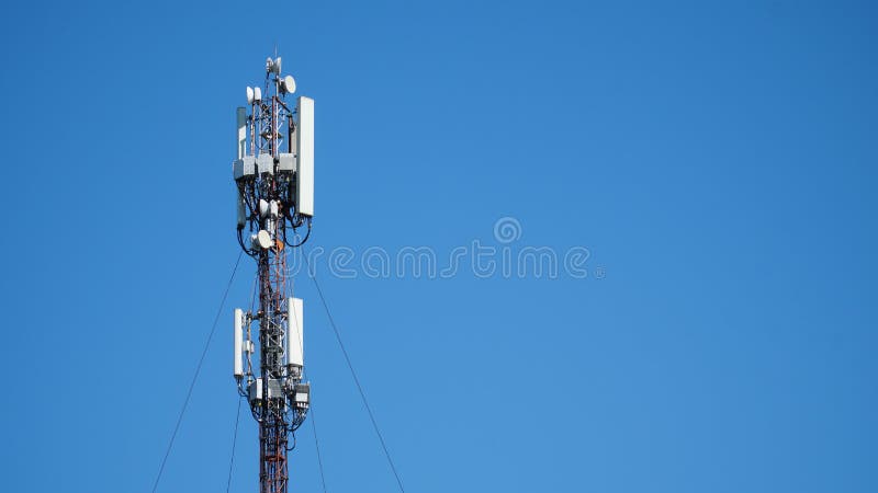 Technology on the top of the telecommunication GSM &#x28;5G,4G,3G&#x29; tower.Cellular phone antennas on a building roof.silhouette of Telecommunication mast television antennas. n. Technology on the top of the telecommunication GSM &#x28;5G,4G,3G&#x29; tower.Cellular phone antennas on a building roof.silhouette of Telecommunication mast television antennas. n