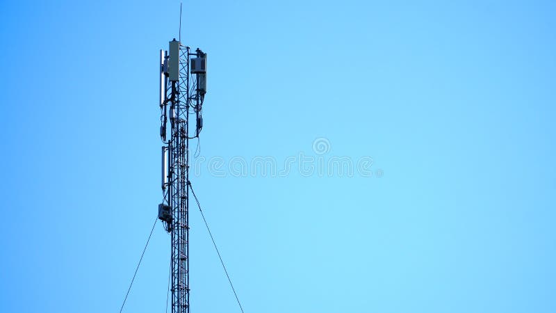 Technology on the top of the telecommunication GSM &#x28;5G,4G,3G&#x29; tower.Cellular phone antennas on a building roof.silhouette of Telecommunication mast television antennas. n. Technology on the top of the telecommunication GSM &#x28;5G,4G,3G&#x29; tower.Cellular phone antennas on a building roof.silhouette of Telecommunication mast television antennas. n