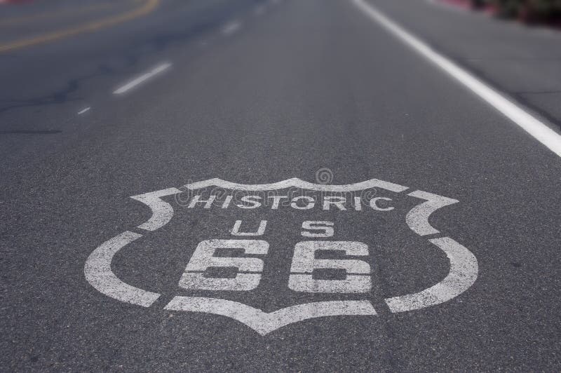 Historic Route 66 Sign on Asphalt road. Historic Route 66 Sign on Asphalt road