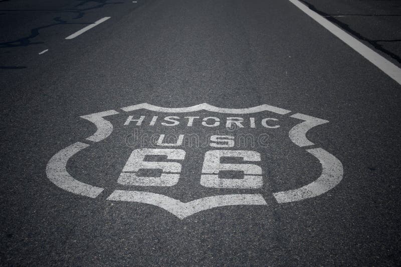 Historic Route 66 Sign on Asphalt road. Historic Route 66 Sign on Asphalt road