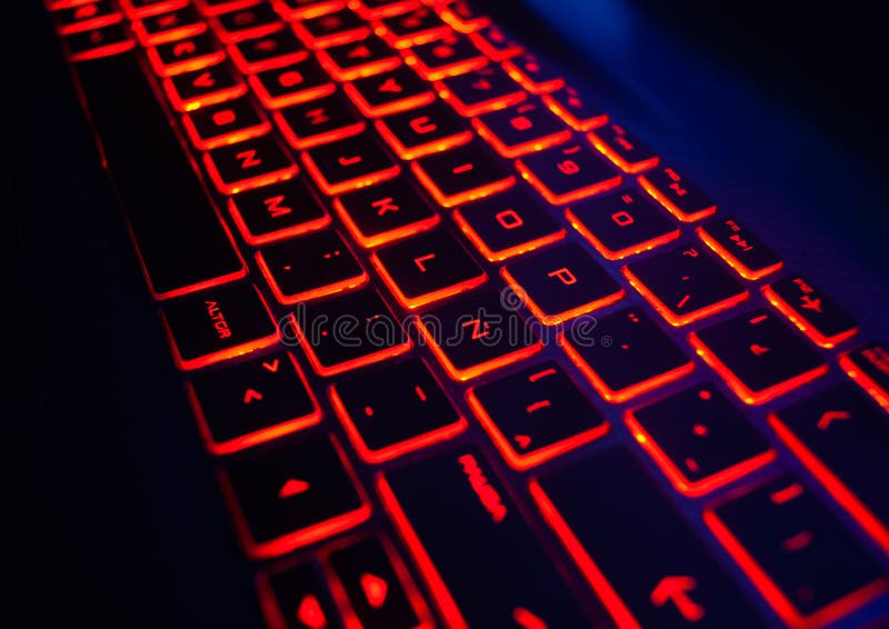 Teclado luminoso rojo del ordenador portátil del bakcklight fotografía de archivo libre de regalías Teclado luminoso rojo del ordenador portátil del bakcklight fotografía de archivo libre de regalías