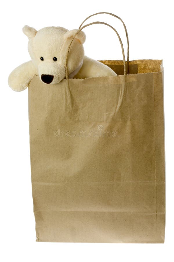 Teddy bear in brown paper bag stock image Teddy bear in brown paper bag stock image