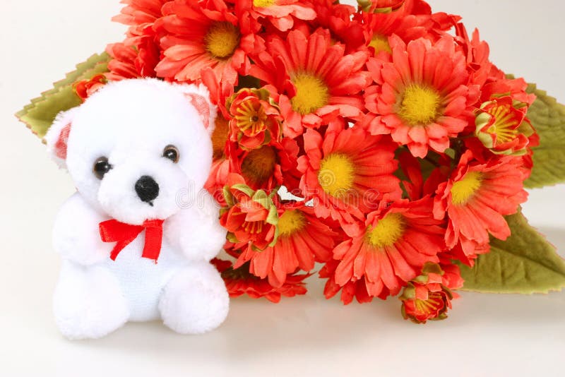 Teddy bear with flowers