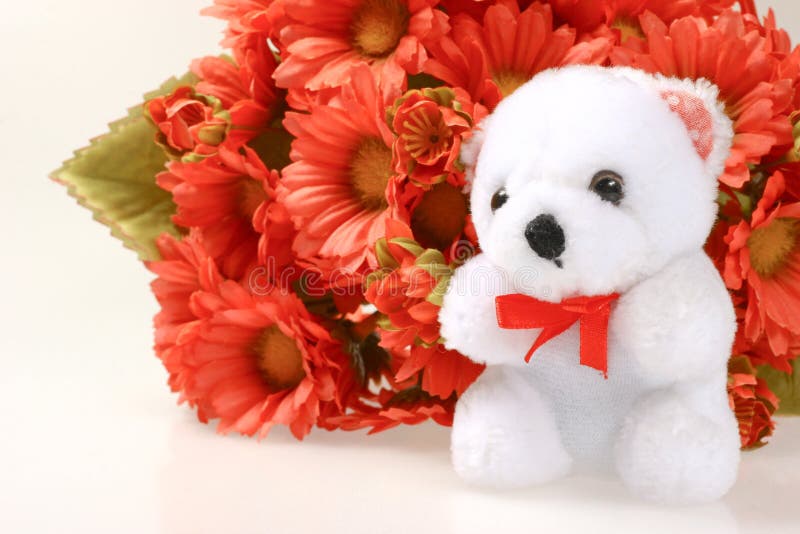 Teddy bear with flowers