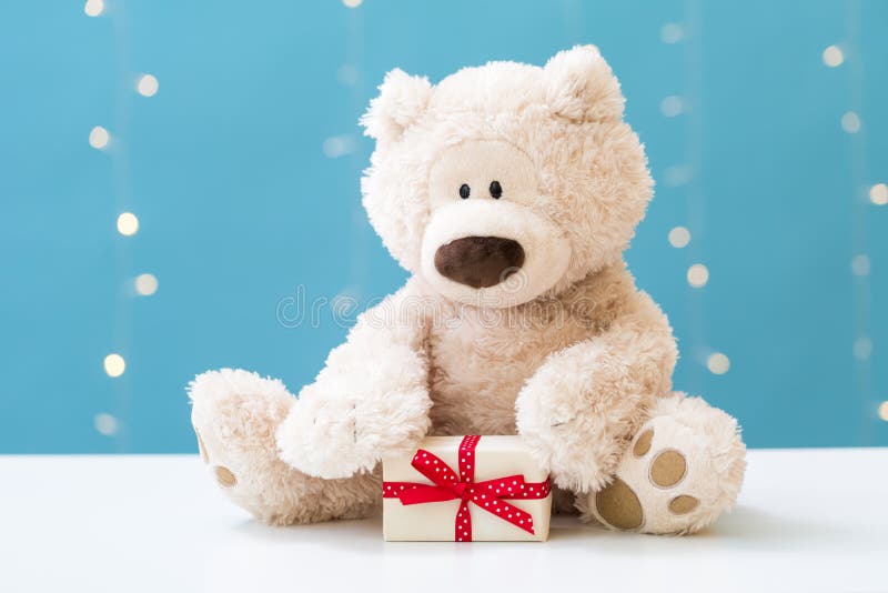 Teddy bear and gift box stock image. Image of blue, shining 125929997