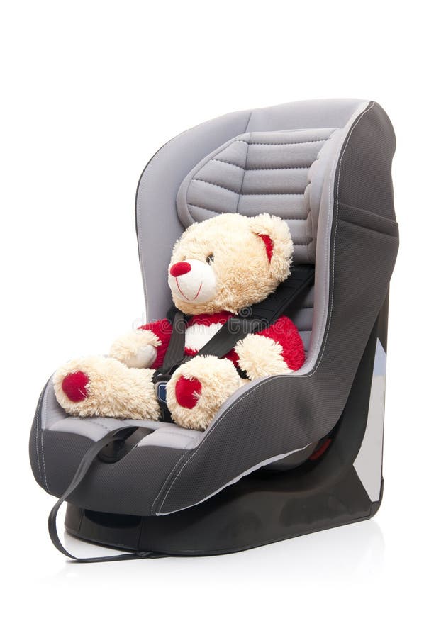 Teddy bear sitting on child s car seat